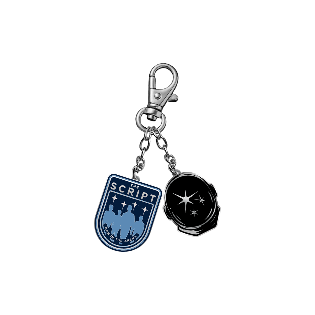 A silver metal keychain featuring two charms: a blue shield-shaped charm with the word 'SCRIPT' and a black octagonal charm with star details, set against a plain white background.